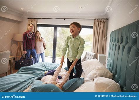 Family On Vacation With Children Playing On Hotel Bed Stock Image Family On Vacation With Children Playing On Hotel Bed Stock Image